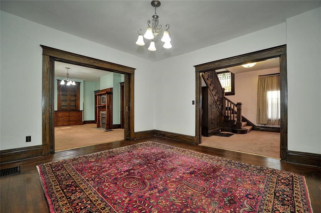 25 Wabash Avenue Hickory, PA 15340 - Photo 7 of 29 a view of a bedroom with wooden floor and a chandelier