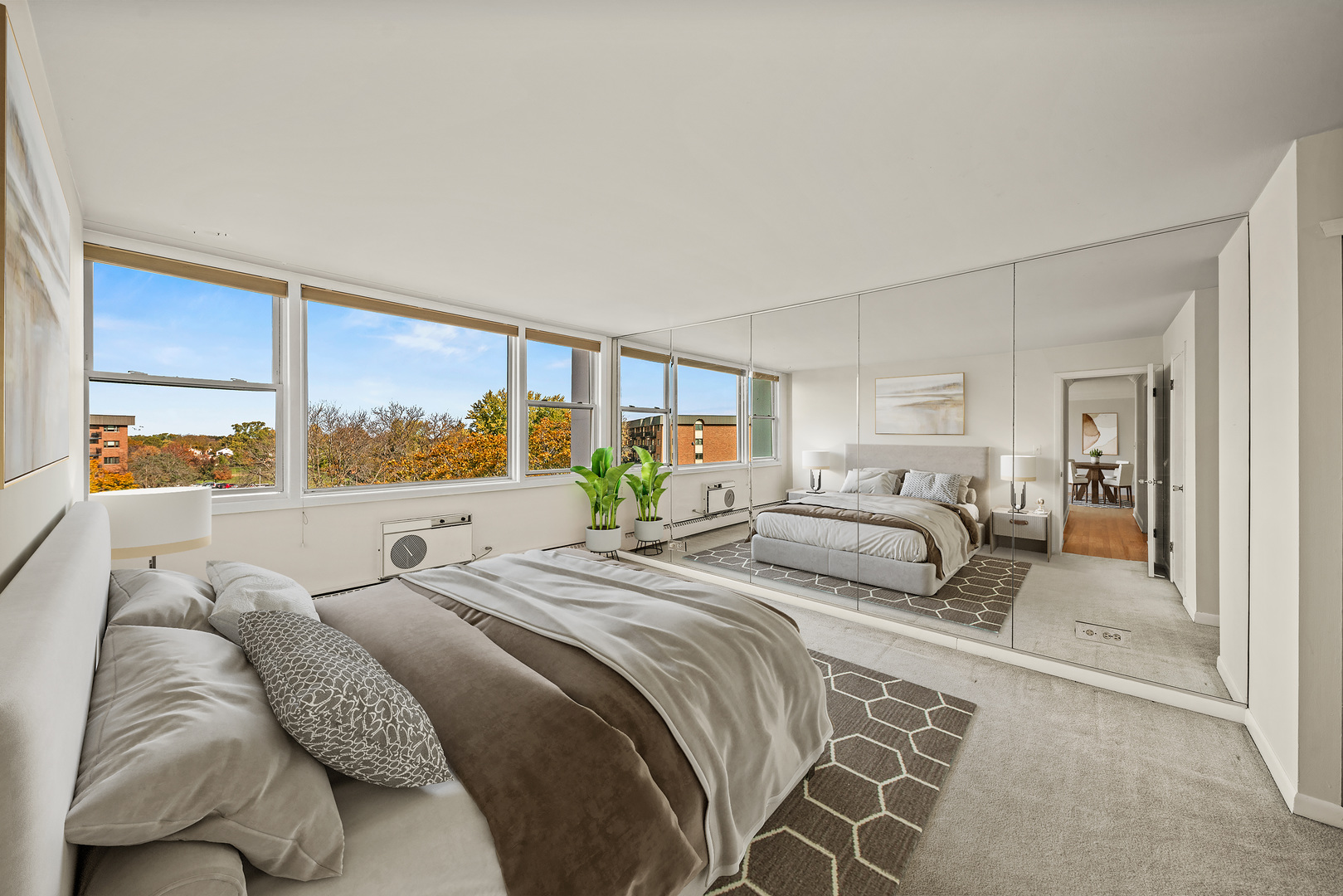 5975 North Odell Avenue, Unit 5C Chicago, IL 60631 - Photo 9 of 20 a bedroom with a large bed and a large window