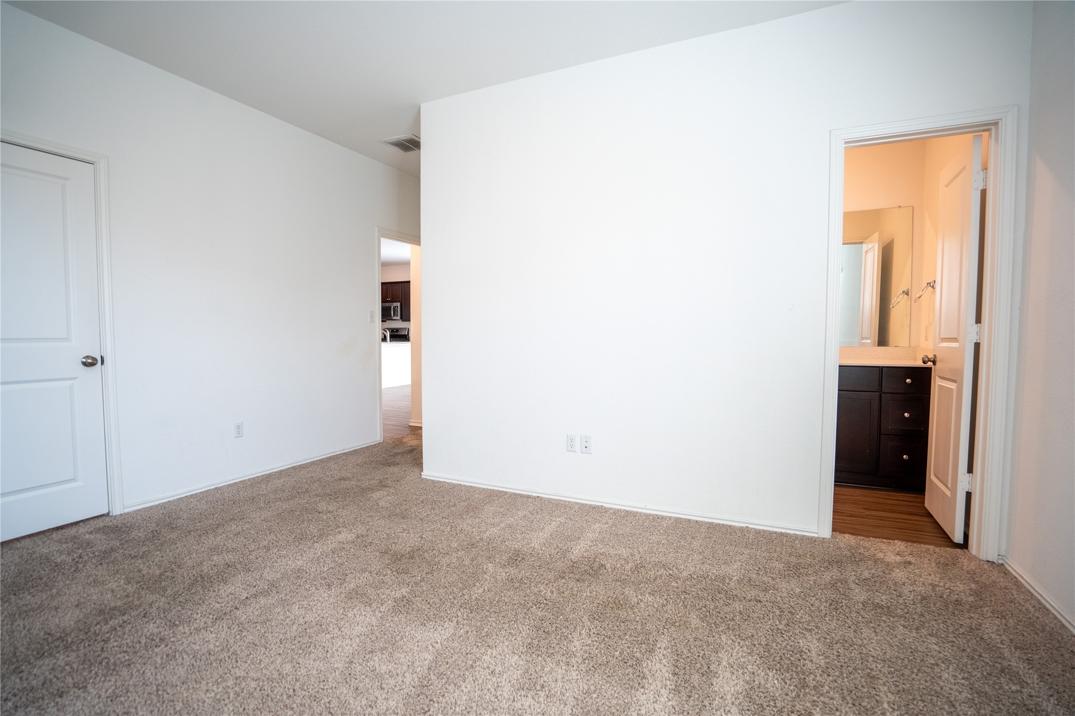 13400 Banquete Street Elgin, TX 78621 - Photo 16 of 29 Unfurnished bedroom with carpet and connected bathroom