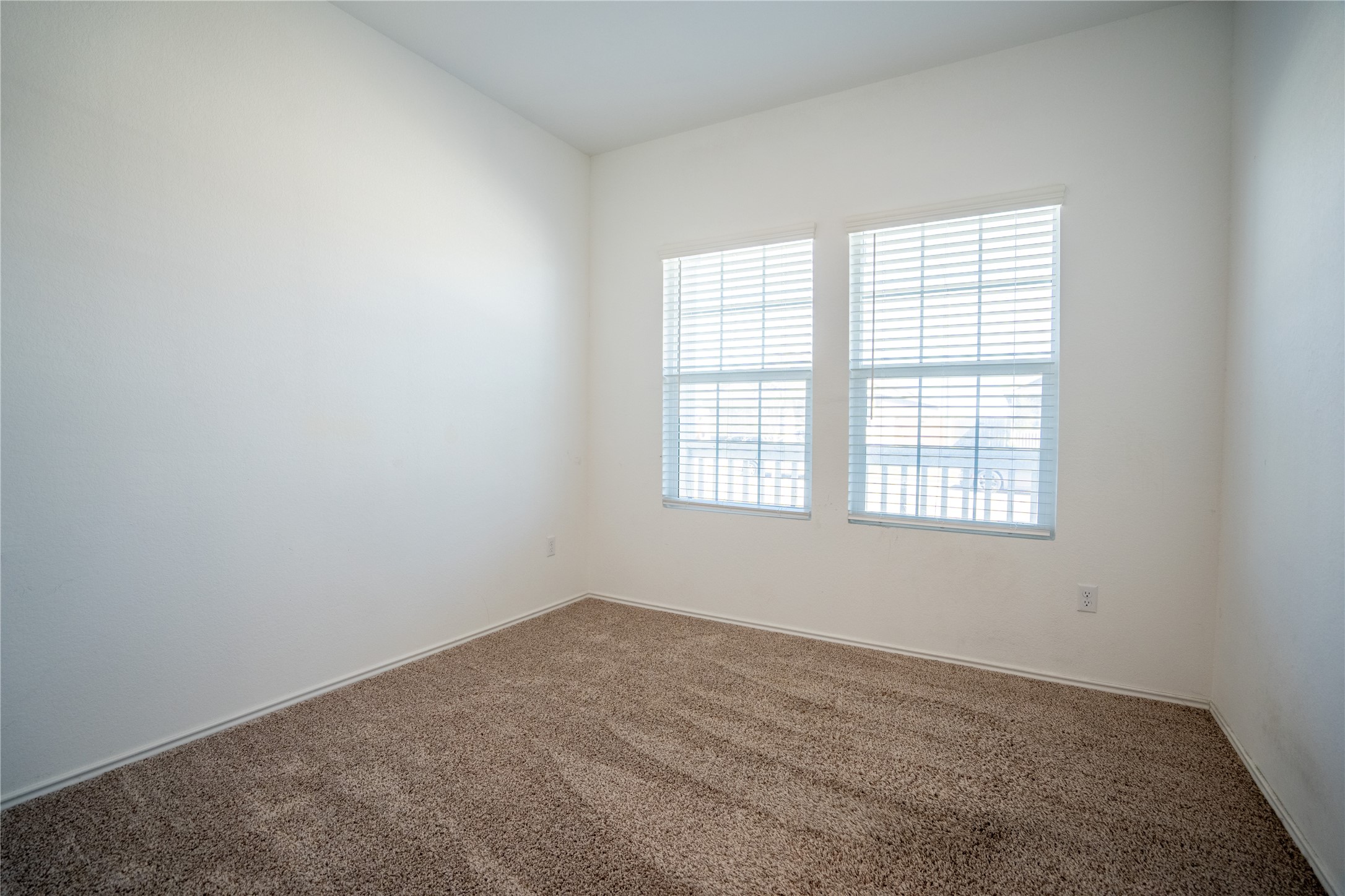 13400 Banquete Street Elgin, TX 78621 - Photo 19 of 29 Empty room featuring dark colored carpet and baseboards