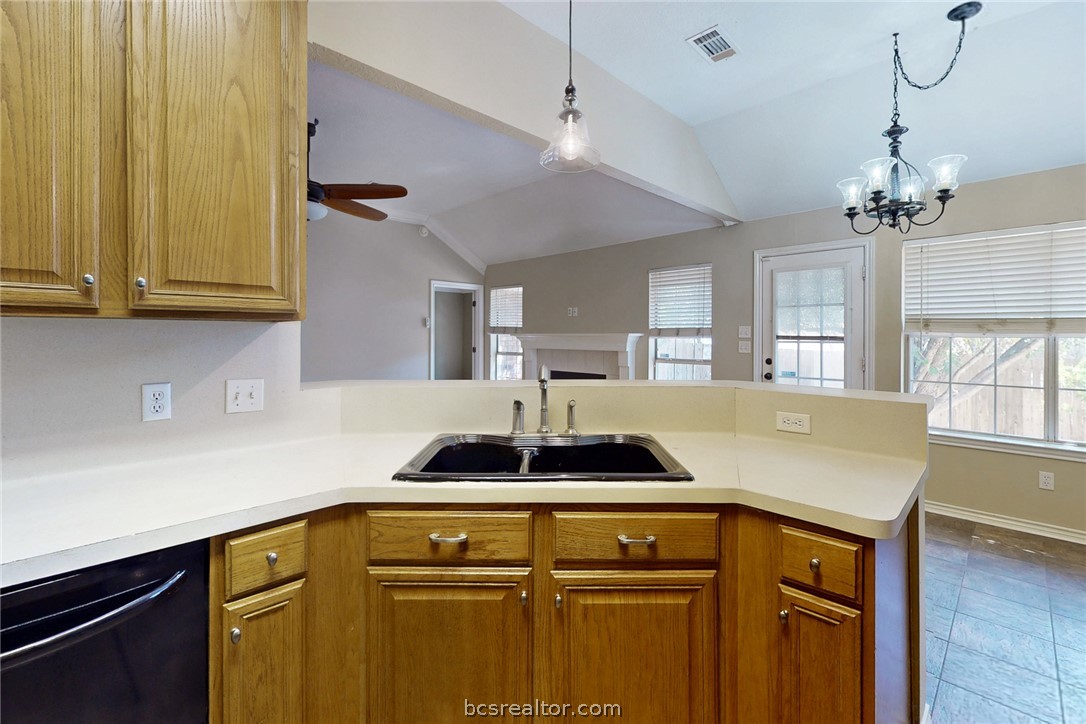 2817 Brandywine Circle Bryan, TX 77807 - Photo 11 of 28 a kitchen with a sink a counter space and a window