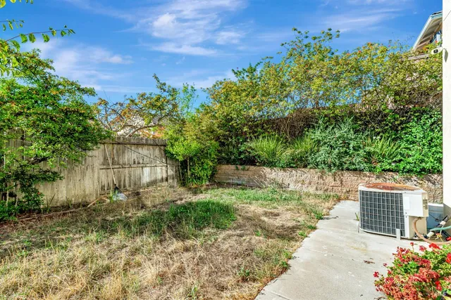 a backyard of a house with lots of green space