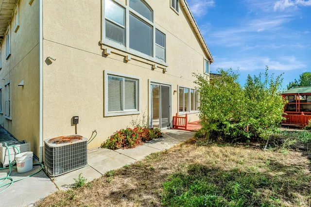 a front view of a house with outdoor seating