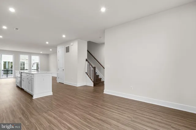a view of kitchen with furniture and wooden floor