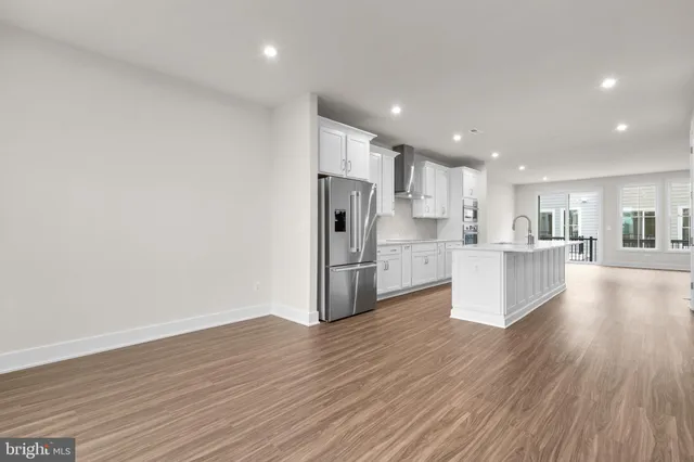 a view of kitchen with wooden floor and window