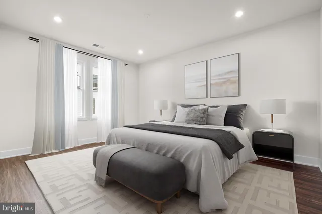 a bedroom with a bed and a couch