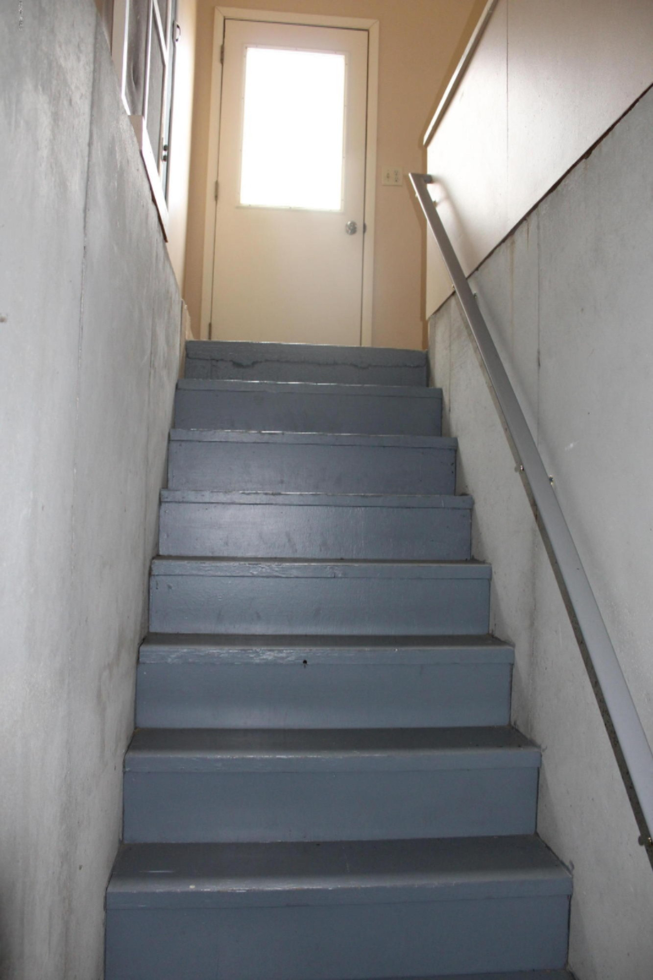 7011 West County Farm Road Greenville, MI 48838 - Photo 43 of 59 Stairs from basement to garage.