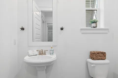 a bedroom with a bed a couch and a window