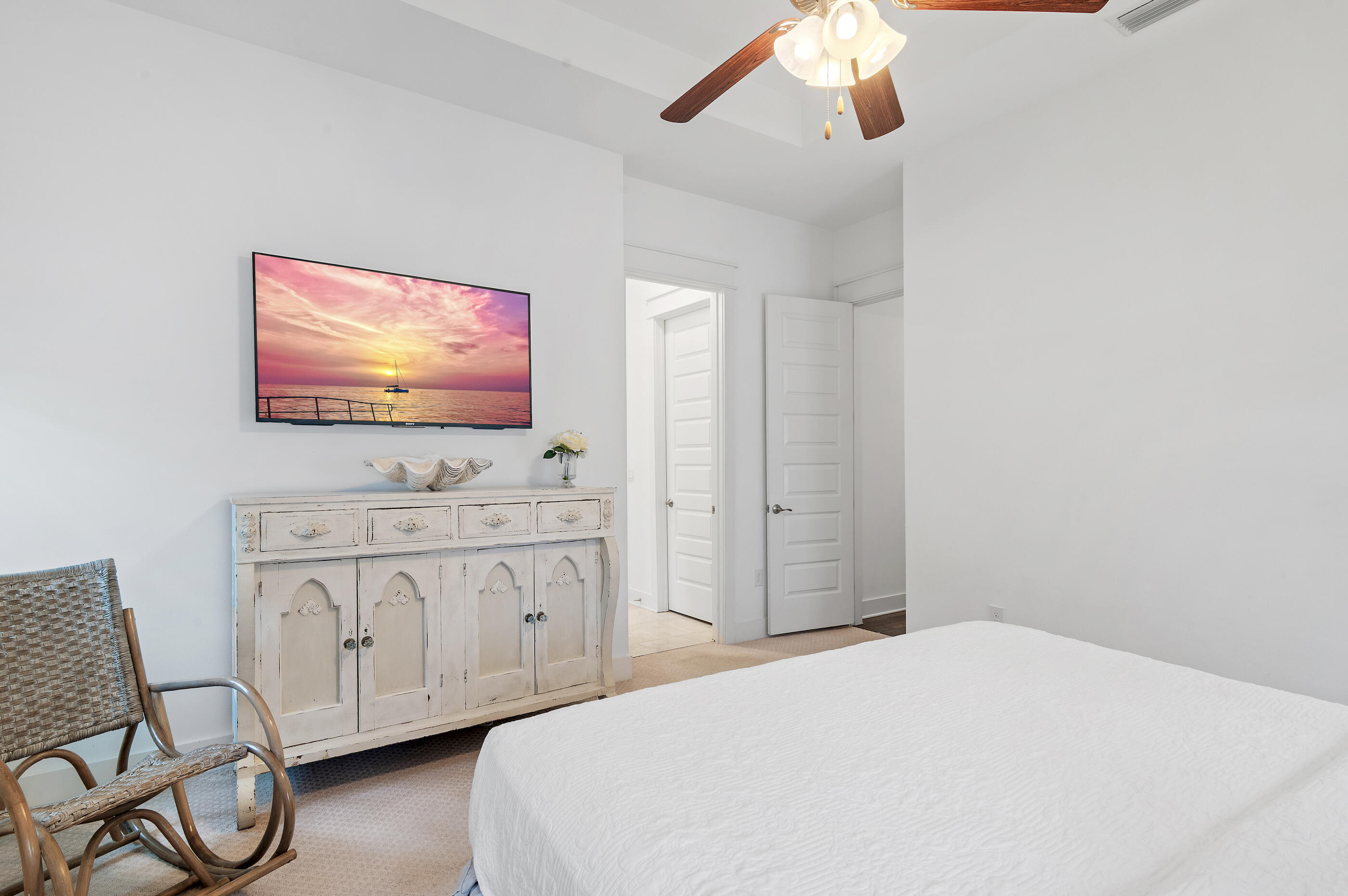 25 Pine Lands Loop East, Unit A Inlet Beach, FL 32461 - Photo 13 of 30 a bedroom with a bed and a flat screen tv