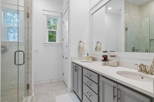 a bedroom with a bed and painting on the wall