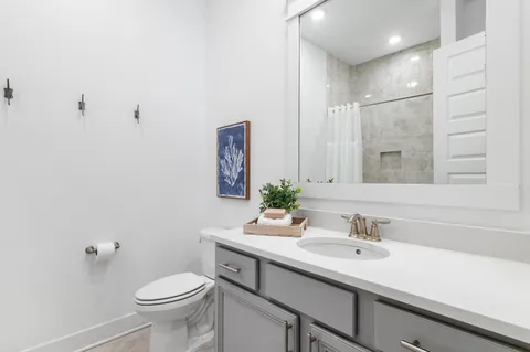 a bedroom with a bed and a tv