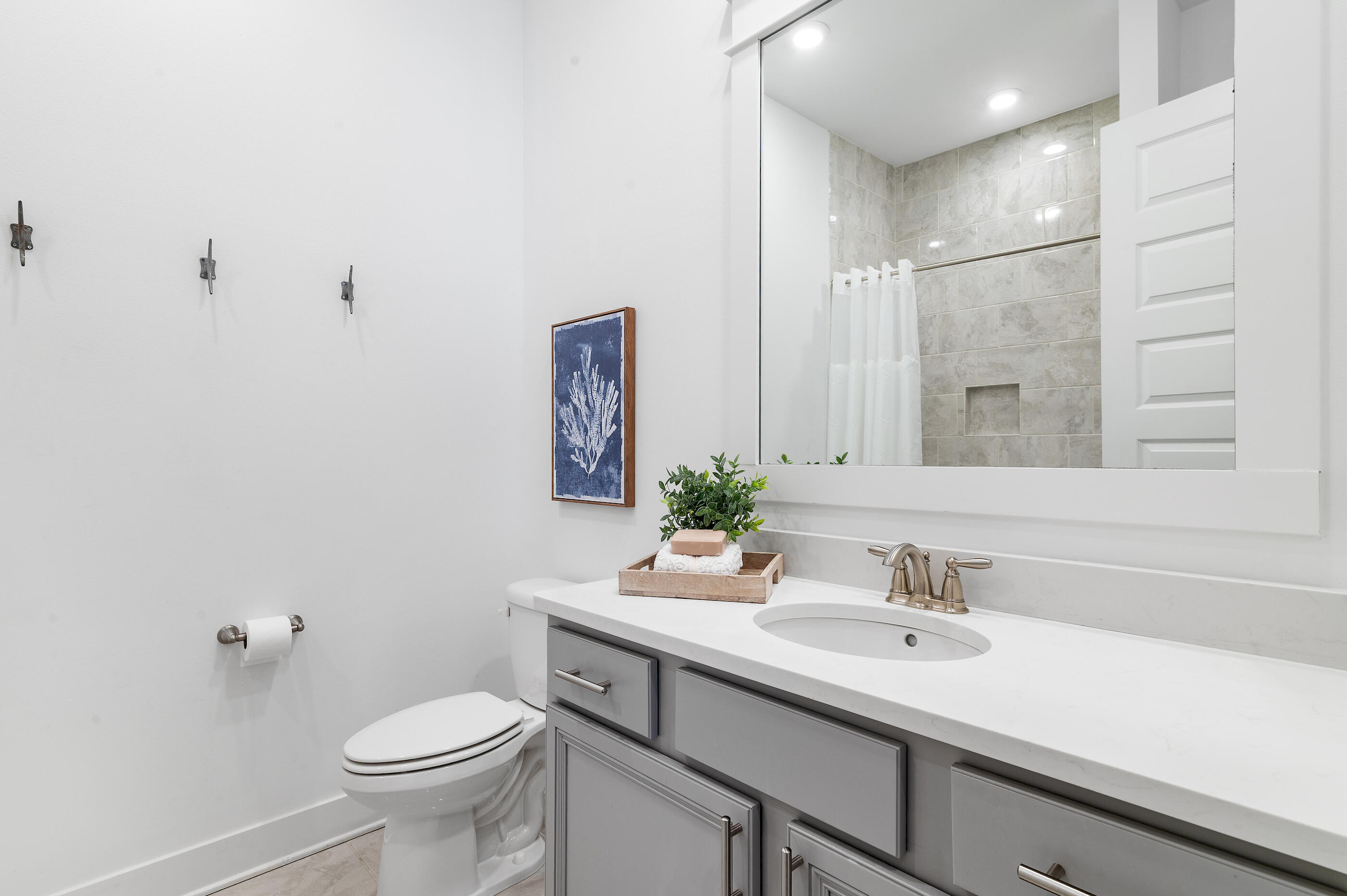 25 Pine Lands Loop East, Unit A Inlet Beach, FL 32461 - Photo 16 of 30 a bathroom with a sink toilet and shower