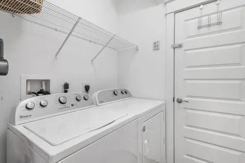 an aerial view of a house with a swimming pool