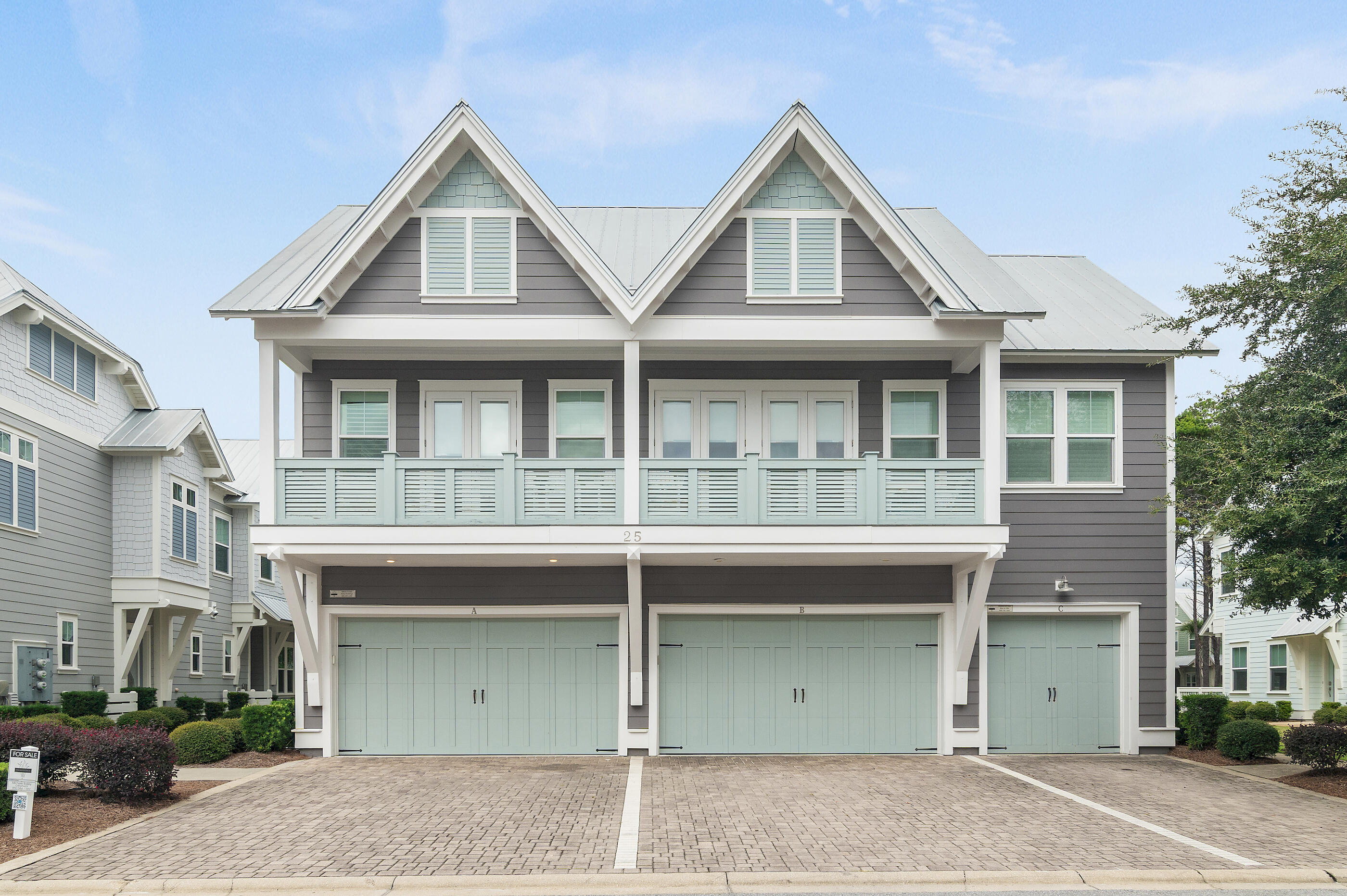 25 Pine Lands Loop East, Unit A Inlet Beach, FL 32461 - Photo 22 of 30 a front view of a house with a garage