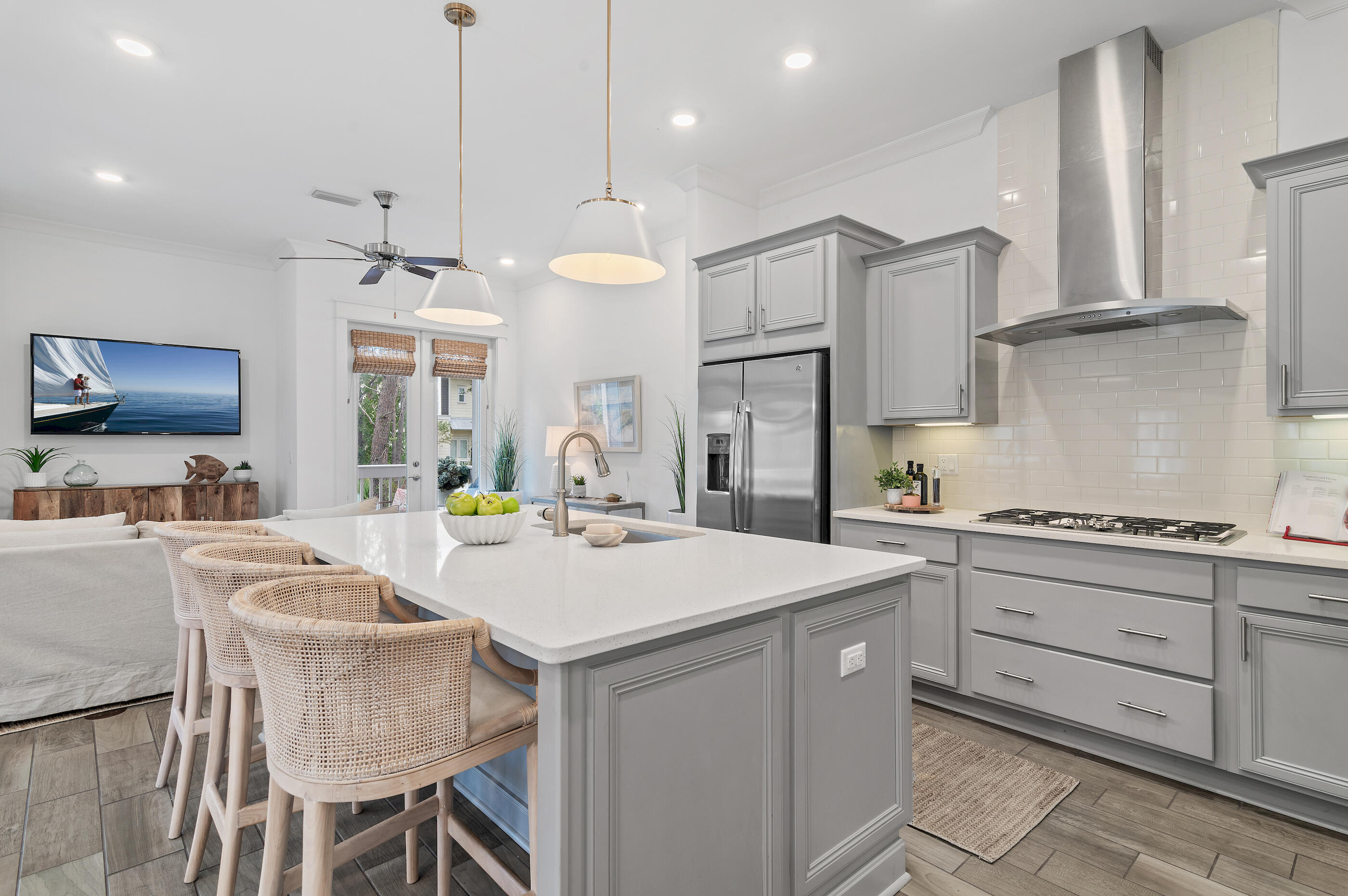 25 Pine Lands Loop East, Unit A Inlet Beach, FL 32461 - Photo 7 of 30 a kitchen with stainless steel appliances granite countertop a sink a stove a refrigerator and island