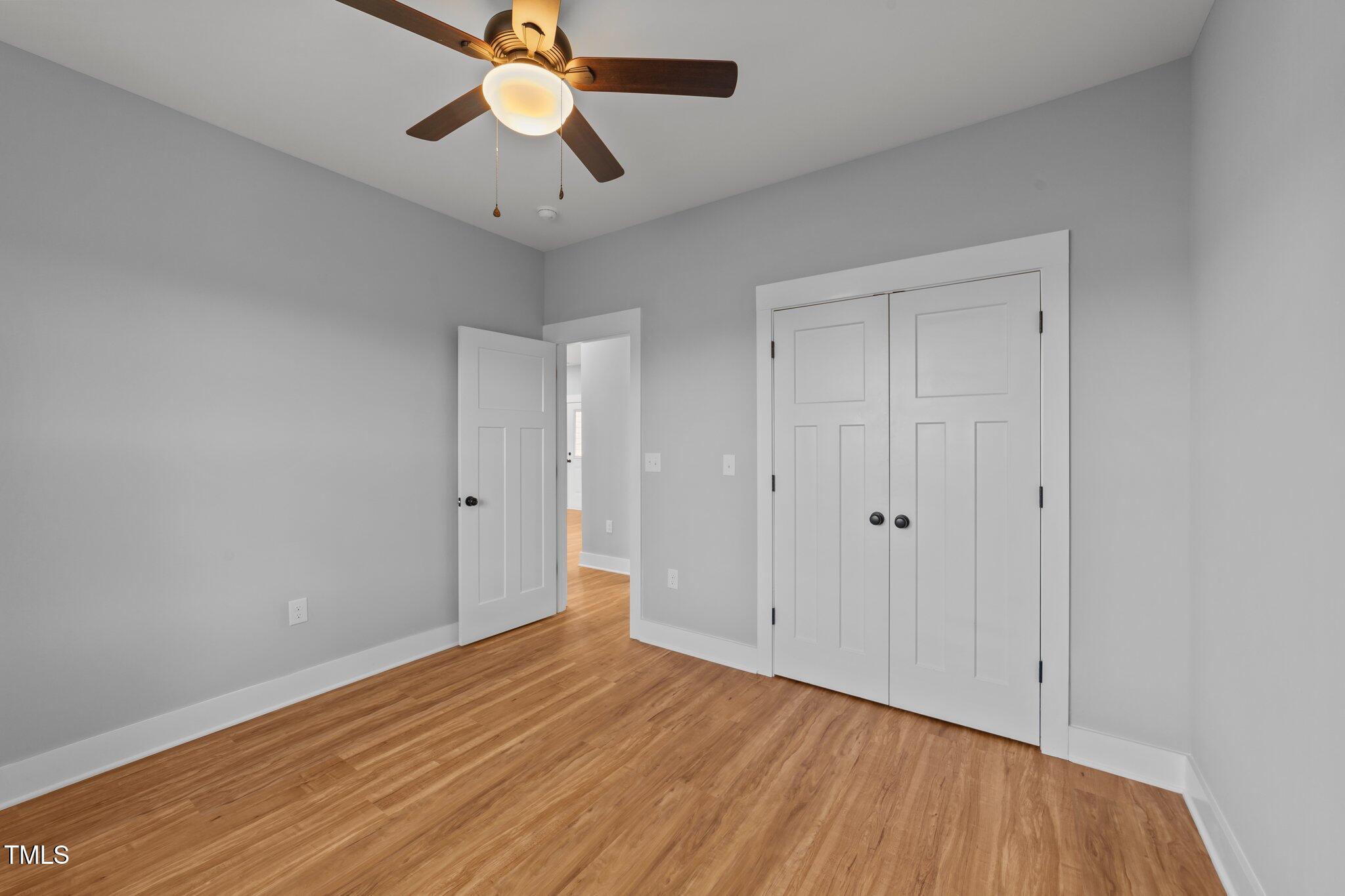 2955 Mt Pleasant Road Willow Spring, NC 27592 - Photo 17 of 44 a view of empty room with wooden floor