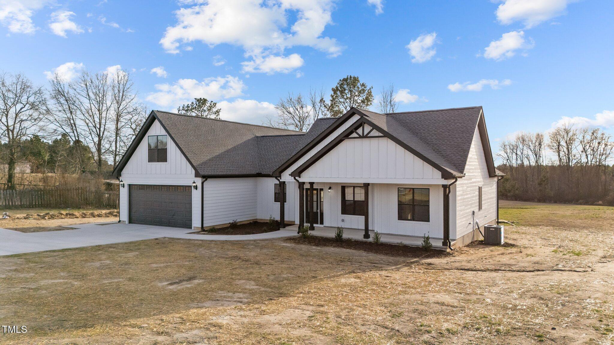 2955 Mt Pleasant Road Willow Spring, NC 27592 - Photo 2 of 44 a view of a house with a yard