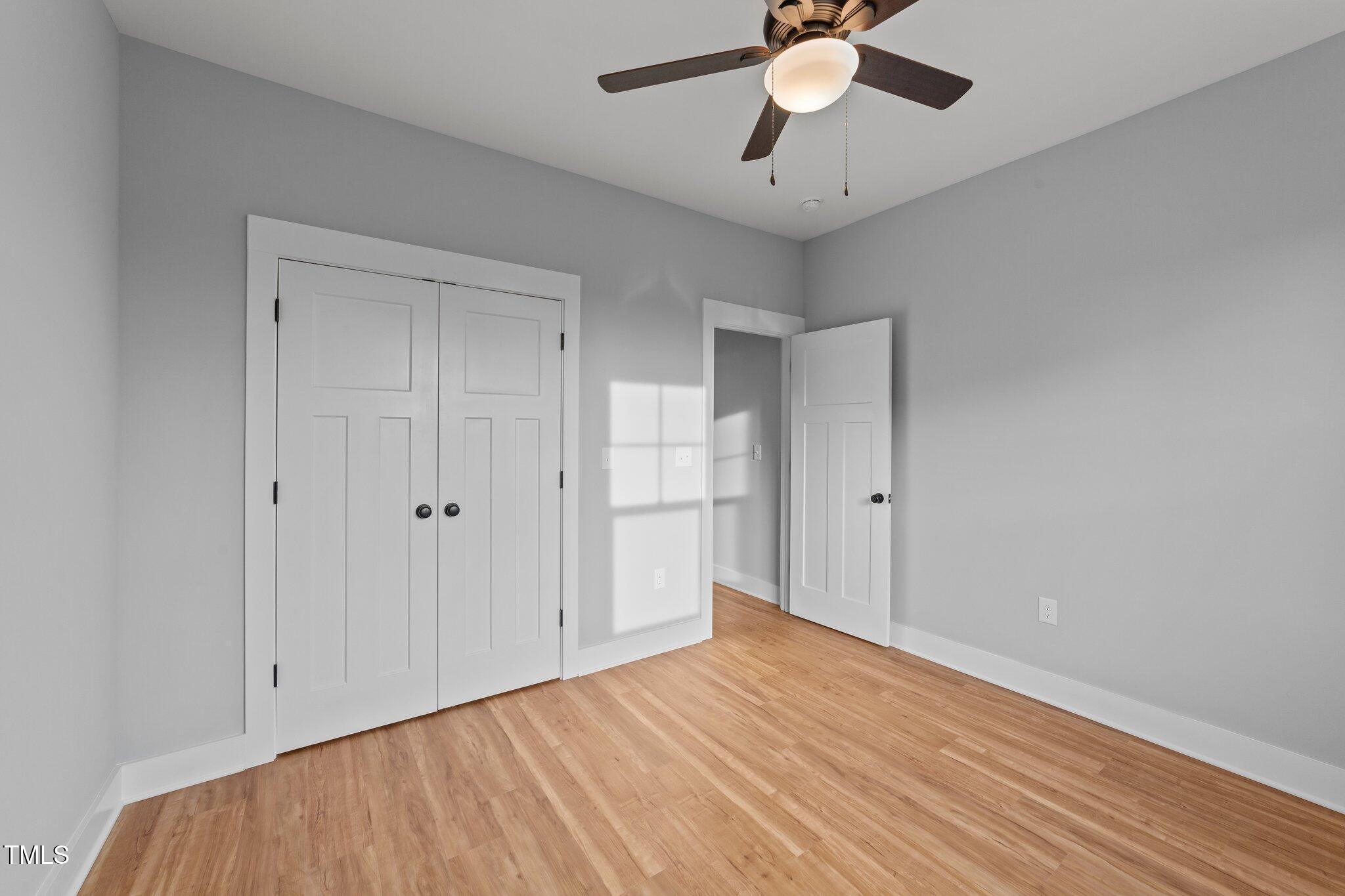 2955 Mt Pleasant Road Willow Spring, NC 27592 - Photo 21 of 44 a view of an empty room and chandelier fan