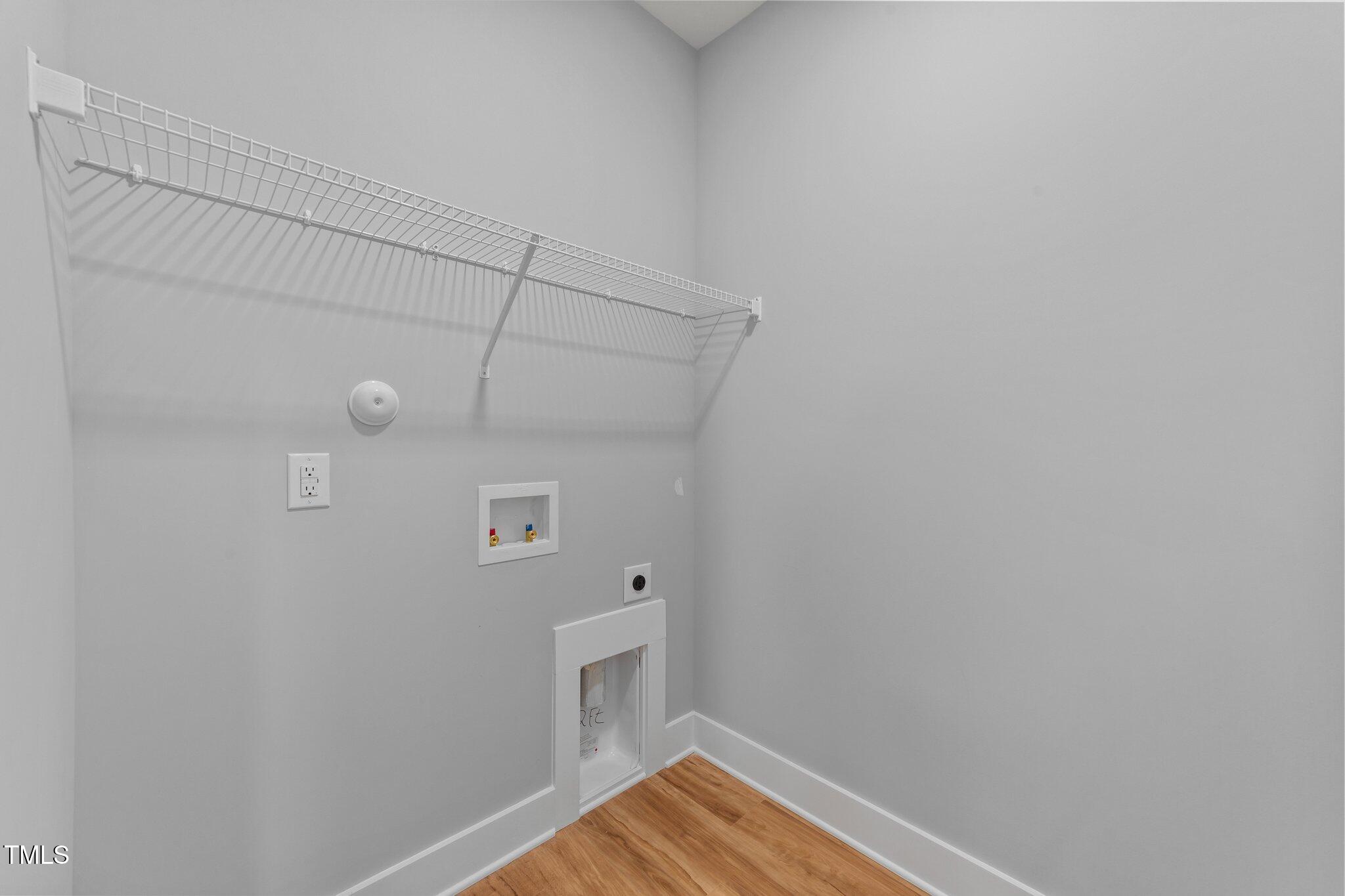 2955 Mt Pleasant Road Willow Spring, NC 27592 - Photo 22 of 44 a view of walk in closet with clothes