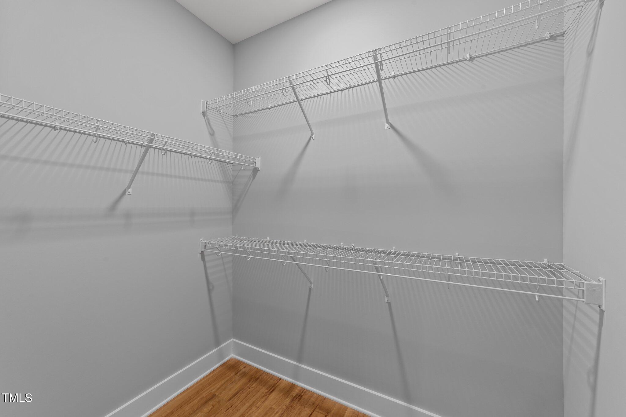 2955 Mt Pleasant Road Willow Spring, NC 27592 - Photo 26 of 44 a view of a room with racks on the wall