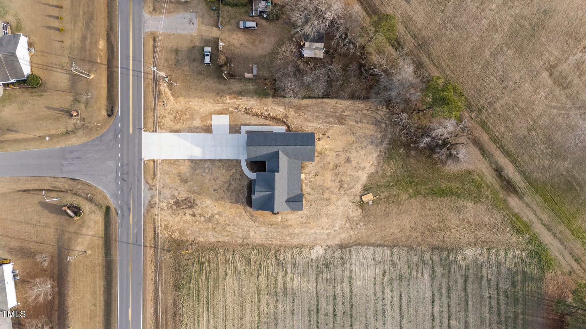 2955 Mt Pleasant Road Willow Spring, NC 27592 - Photo 35 of 44 a bathroom with a granite countertop sink and a mirror