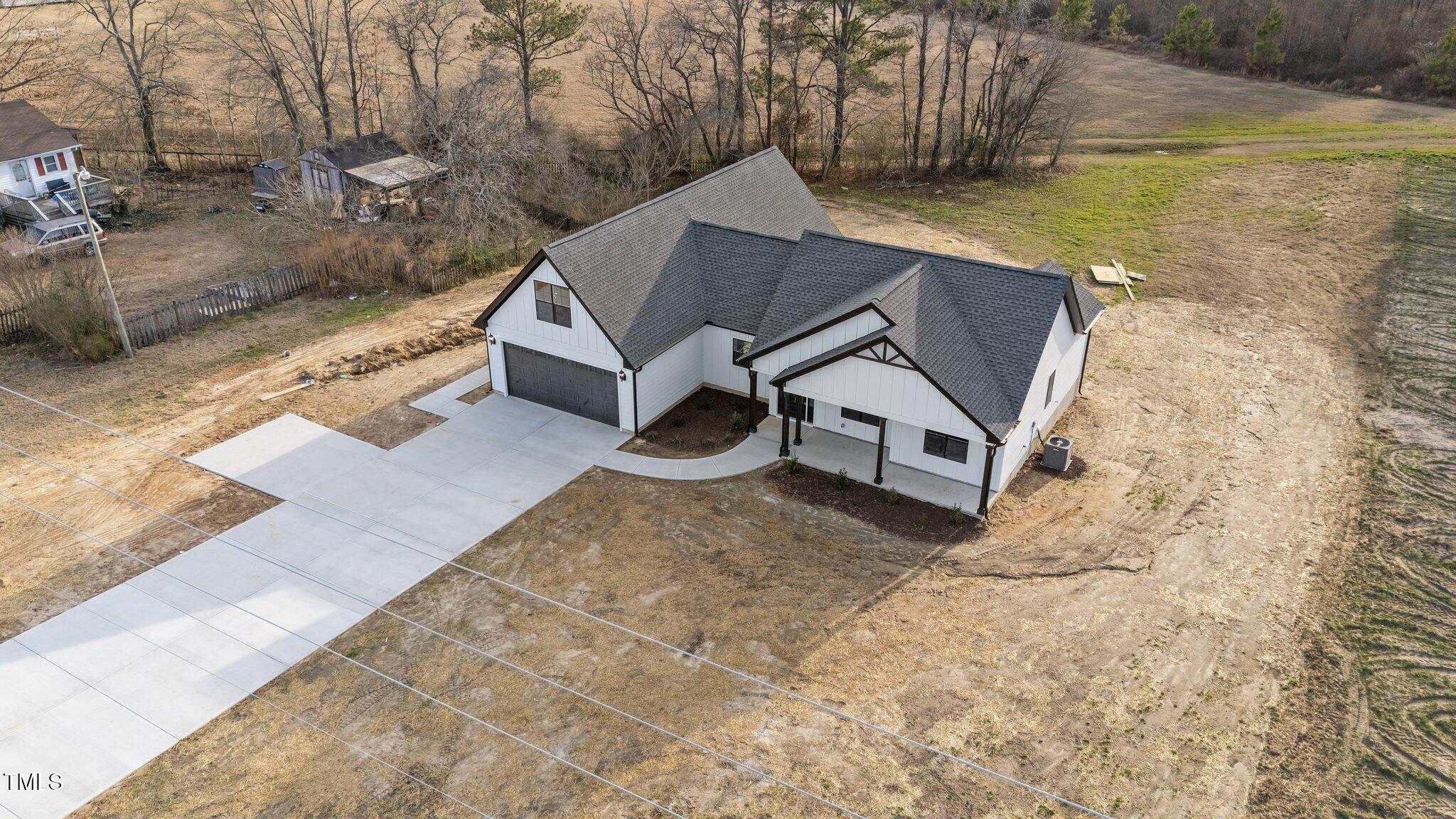 2955 Mt Pleasant Road Willow Spring, NC 27592 - Photo 37 of 44 a view of a house with a yard