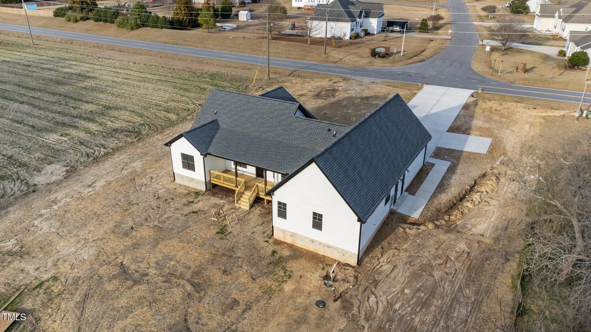 2955 Mt Pleasant Road Willow Spring, NC 27592 - Photo 40 of 44 a view of roof deck with wooden floor and seating space
