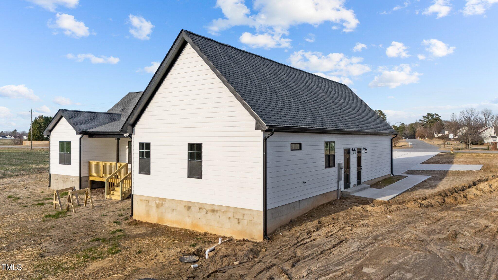 2955 Mt Pleasant Road Willow Spring, NC 27592 - Photo 42 of 44 a view of a house with backyard and sitting area