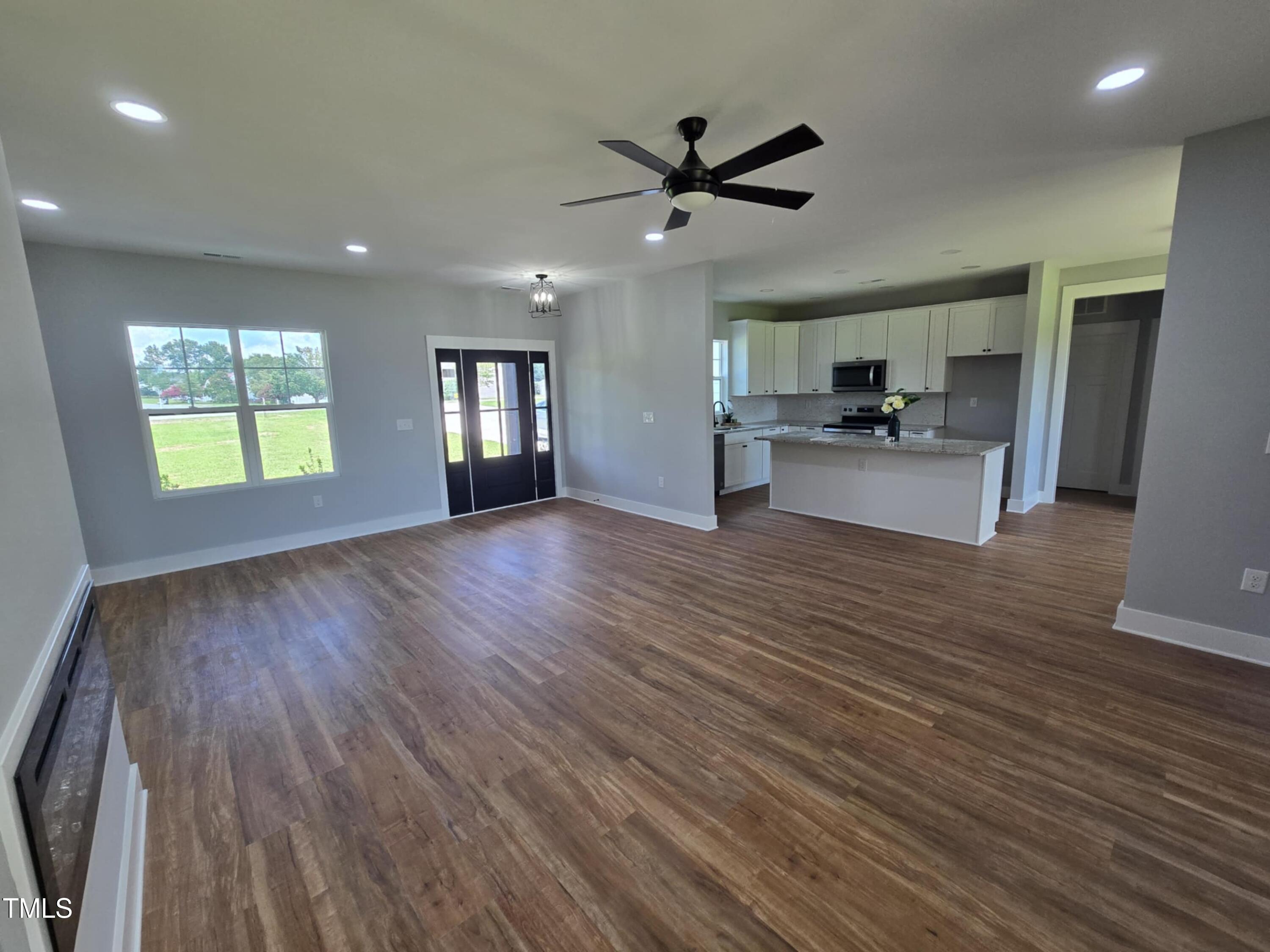2955 Mt Pleasant Road Willow Spring, NC 27592 - Photo 8 of 44 a view of empty room with wooden floor and window