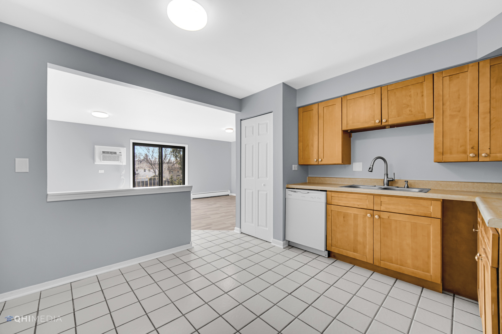 258 East Bailey Road, Unit J Naperville, IL 60565 - Photo 11 of 22 a kitchen with a sink cabinets and window