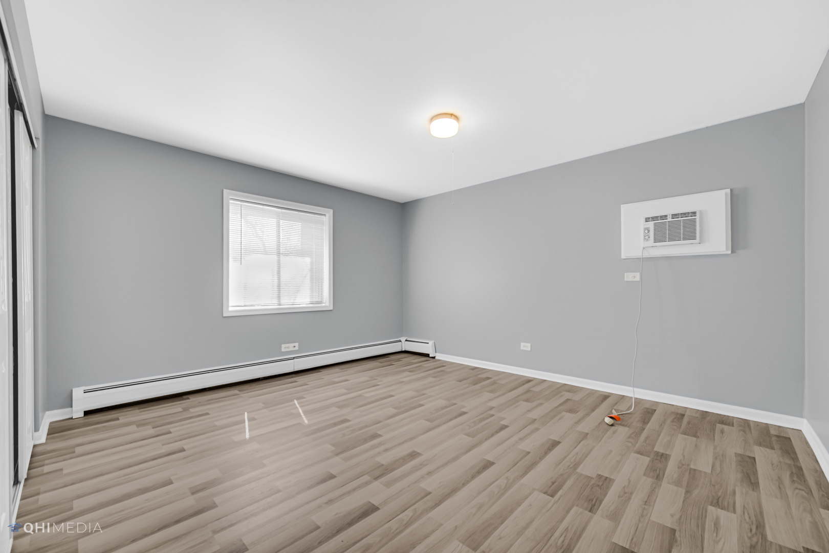 258 East Bailey Road, Unit J Naperville, IL 60565 - Photo 13 of 22 an empty room with wooden floor and windows