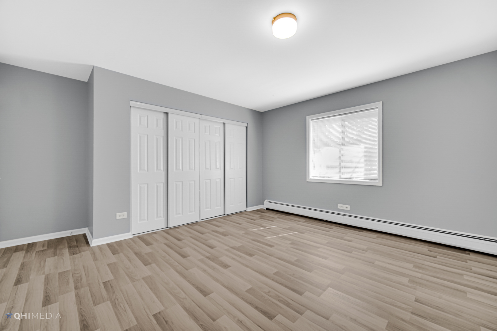 258 East Bailey Road, Unit J Naperville, IL 60565 - Photo 14 of 22 an empty room with wooden floor and windows