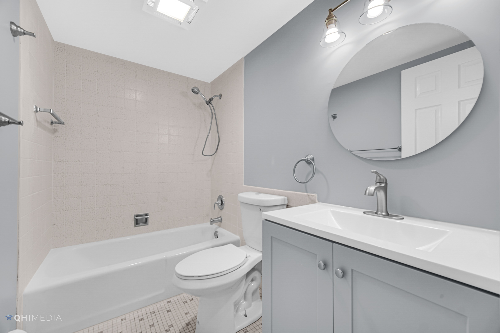 258 East Bailey Road, Unit J Naperville, IL 60565 - Photo 15 of 22 a bathroom with a sink a toilet and shower