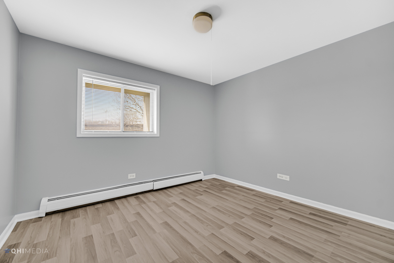 258 East Bailey Road, Unit J Naperville, IL 60565 - Photo 16 of 22 wooden floor in an empty room with a window