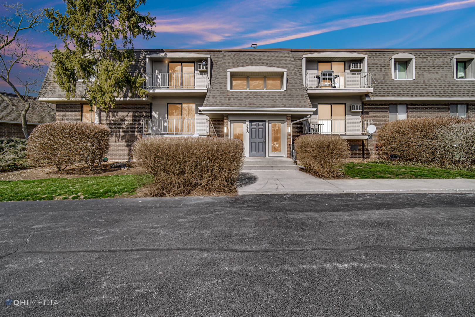 258 East Bailey Road, Unit J Naperville, IL 60565 - Photo 19 of 22 a front view of a house with garden