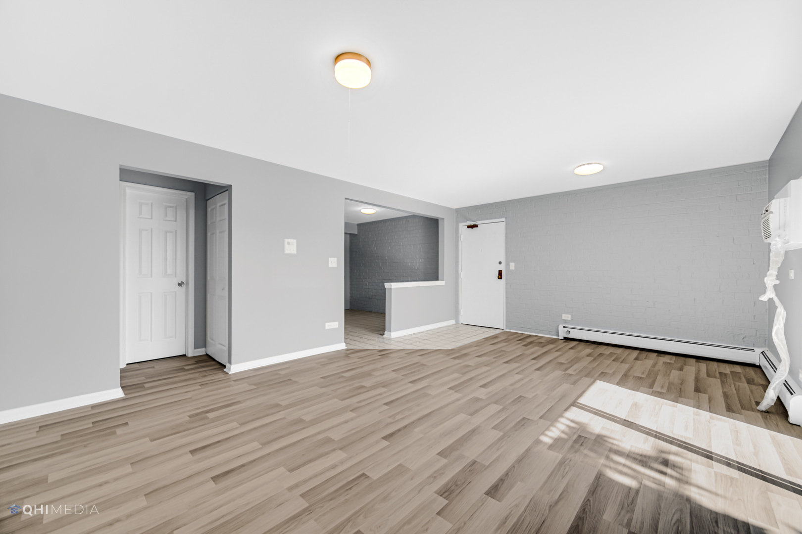258 East Bailey Road, Unit J Naperville, IL 60565 - Photo 6 of 22 a view of a livingroom with wooden floor