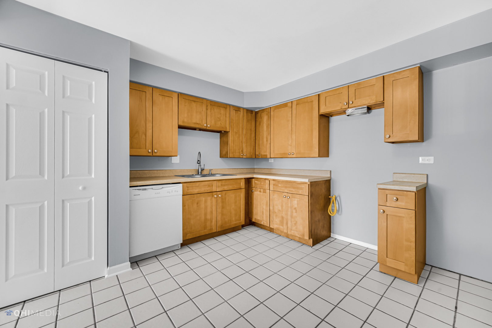 258 East Bailey Road, Unit J Naperville, IL 60565 - Photo 8 of 22 a kitchen with a sink cabinets and a window