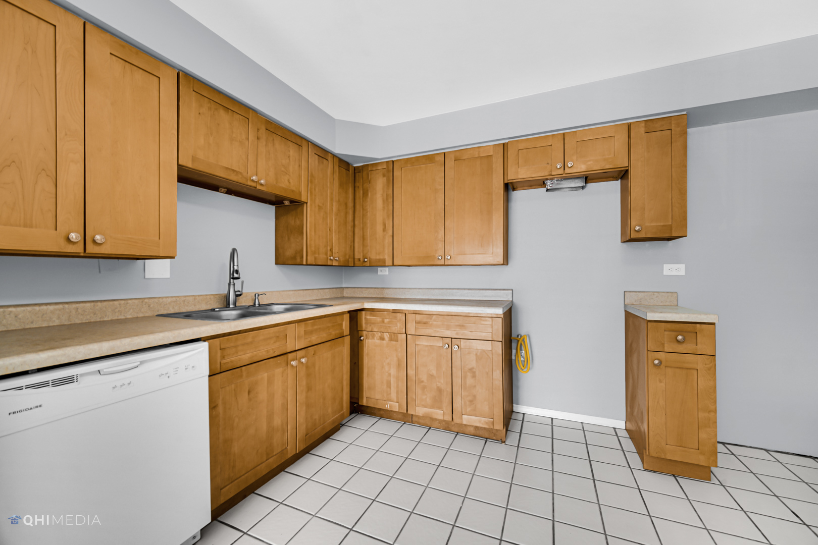 258 East Bailey Road, Unit J Naperville, IL 60565 - Photo 9 of 22 a kitchen with a sink and cabinets