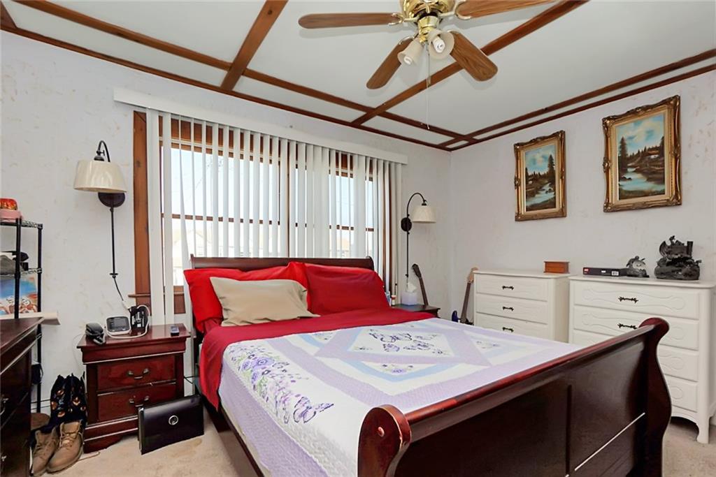 2318 Knapp Street Brooklyn, NY 11229 - Photo 11 of 32 a bedroom with a bed and a dresser