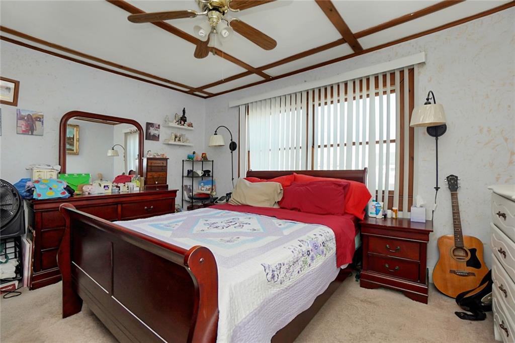 2318 Knapp Street Brooklyn, NY 11229 - Photo 12 of 32 a bed room with a bed and a tv