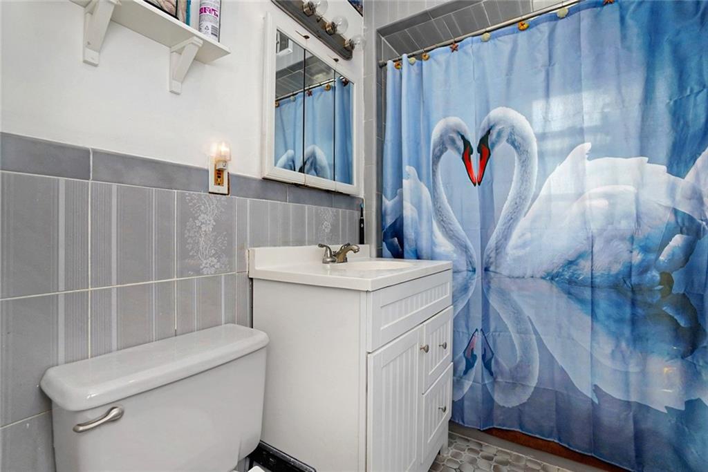 2318 Knapp Street Brooklyn, NY 11229 - Photo 13 of 32 a bathroom with a sink and toilet
