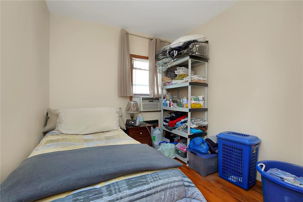2318 Knapp Street Brooklyn, NY 11229 - Photo 14 of 32 a bedroom with a bed and a window