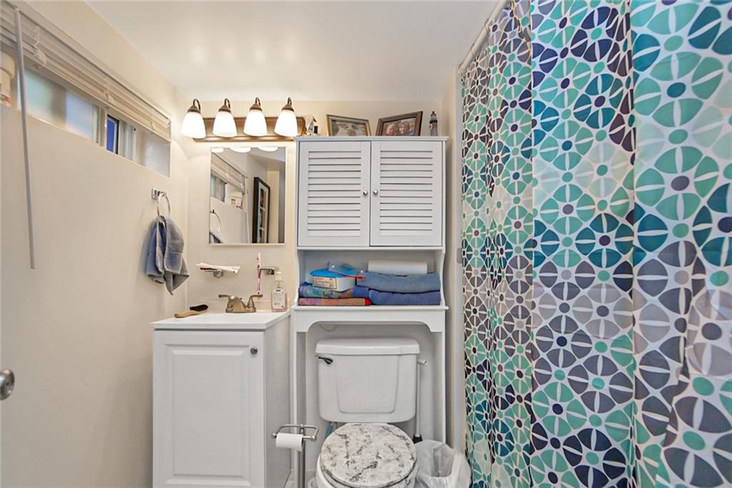 2318 Knapp Street Brooklyn, NY 11229 - Photo 20 of 32 a bathroom with a sink toilet and shower