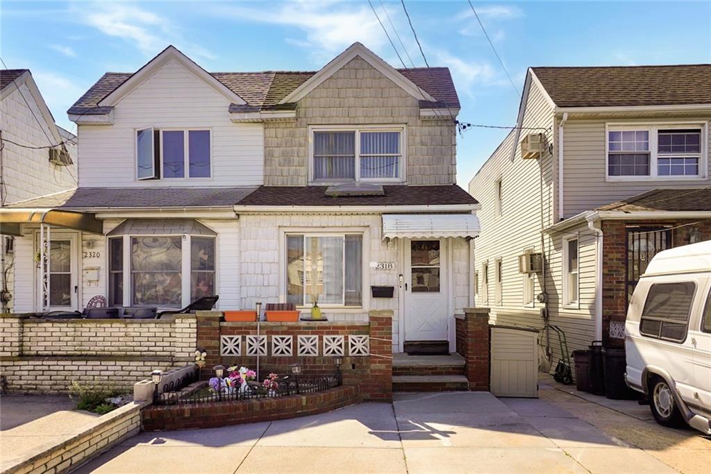 2318 Knapp Street Brooklyn, NY 11229 - Photo 3 of 32 a view of a white house with large windows and a street