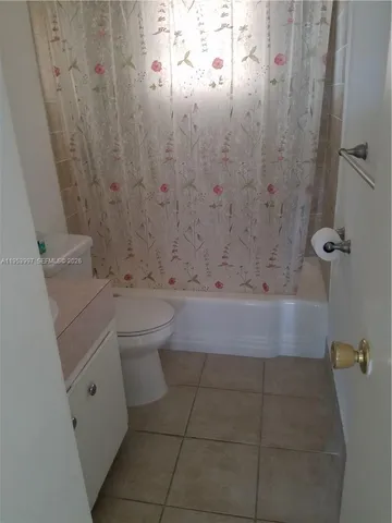 a bathroom with a sink and shower