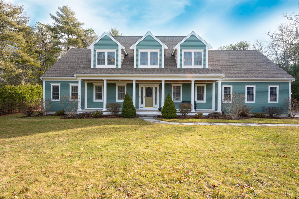 a front view of a house with a yard