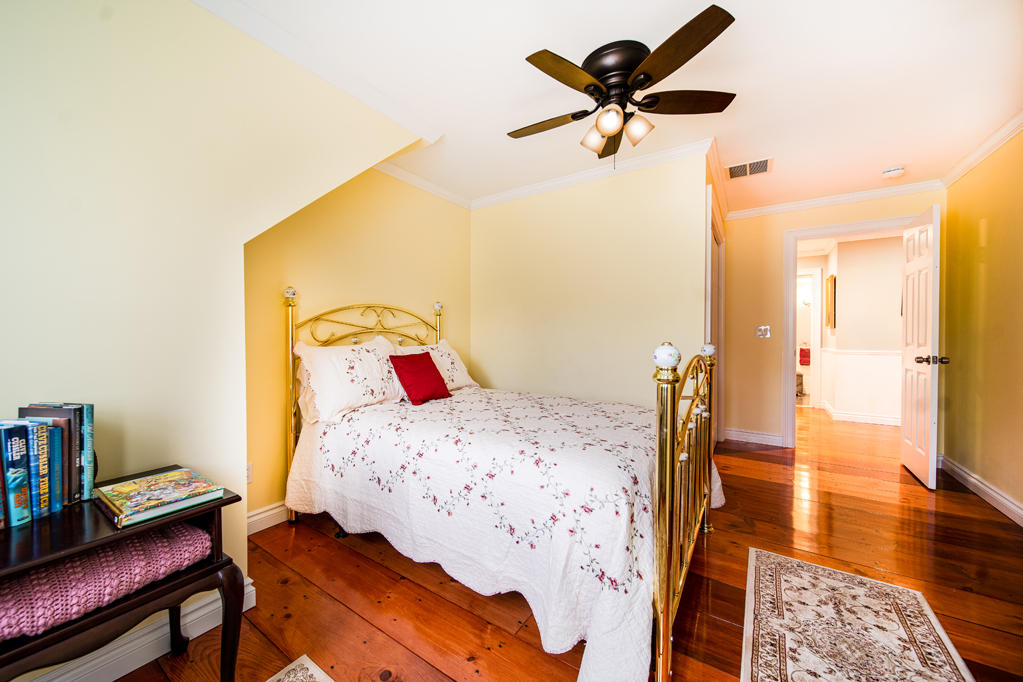 527 County Road Pocasset, MA 02559 - Photo 12 of 25 a bedroom with a bed and wooden floor