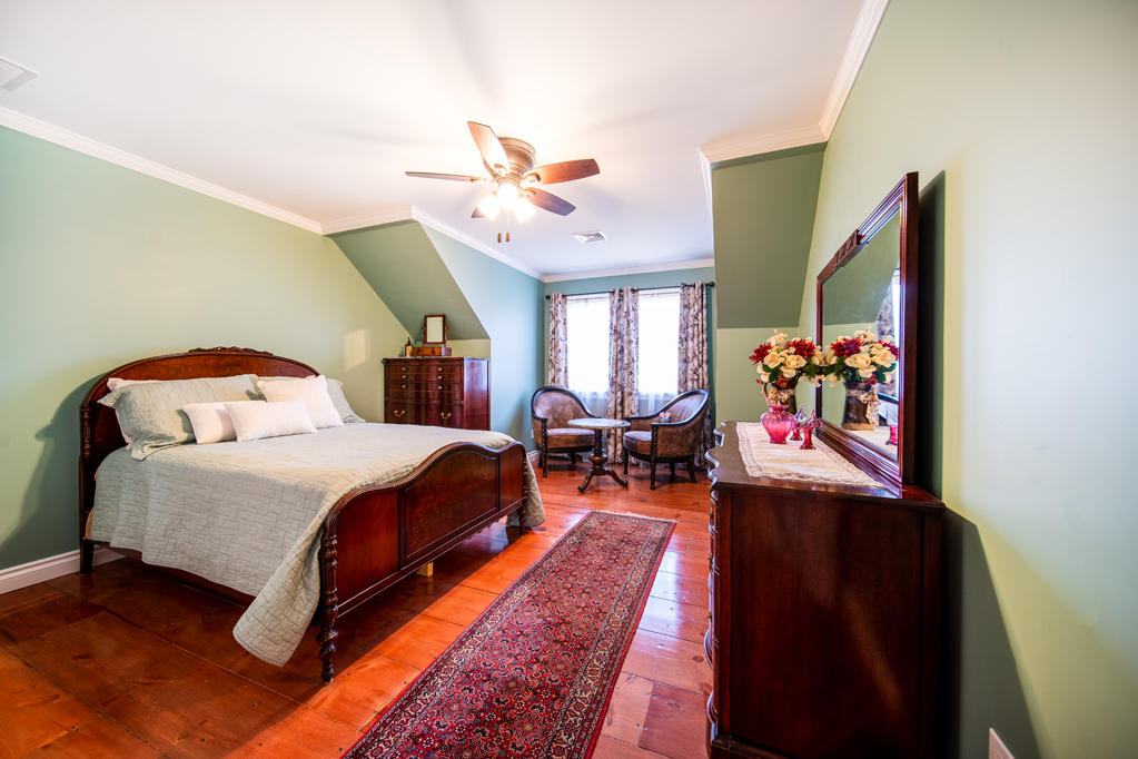 527 County Road Pocasset, MA 02559 - Photo 13 of 25 a bedroom with a bed and wooden floor