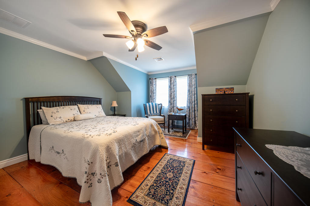 527 County Road Pocasset, MA 02559 - Photo 14 of 25 a bedroom with a bed and wooden floor