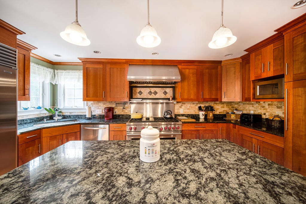 527 County Road Pocasset, MA 02559 - Photo 2 of 25 outdoor kitchen with stainless steel appliances granite countertop a stove sink and cabinets